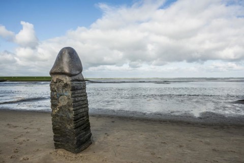 Stone sculpture on the beach and Wadden Sea, penis, artist Eckart Grenzer, Dangast, Jade Bay, North