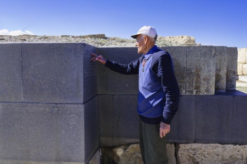 Ruins of the Urartian citadel of Cavustepe, Wardian explaining the cuneiform writing, Van, Turkey,