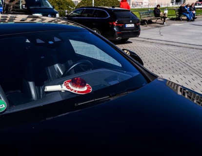 Parked police vehicle with red stop stick behind the windscreen, Berlin, Germany, Europe