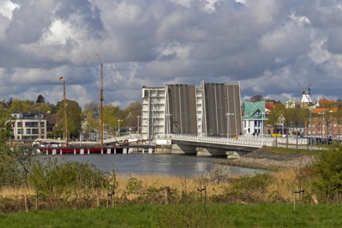 Sailing ship passes through open bascule bridge, Kappeln, Schlei, Schleswig-Holstein, Germany,