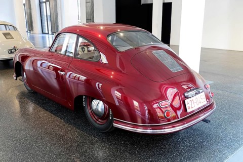 Rear view of a red Porsche 356 Coupe, exhibited in a car museum, AUTOMUSEUM PROTOTYP, Hamburg,