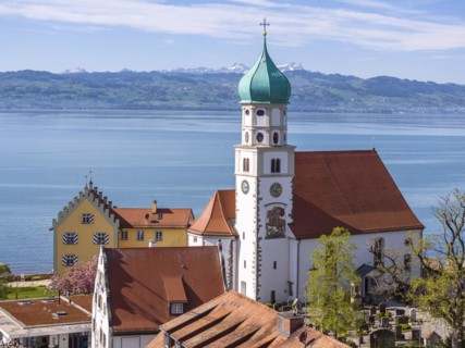 Moated castle peninsula with castle and parish church of St George on Lake Constance. Aerial view,