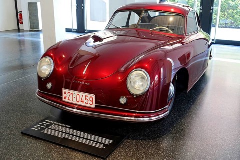 A red Porsche 356 Coupe on display, view of the front of the historic car, AUTOMUSEUM PROTOTYP,