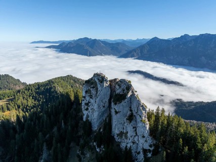 Aerial view, rocky summit of the Ettaler Manndl, view over mountain landscape and sea of clouds,