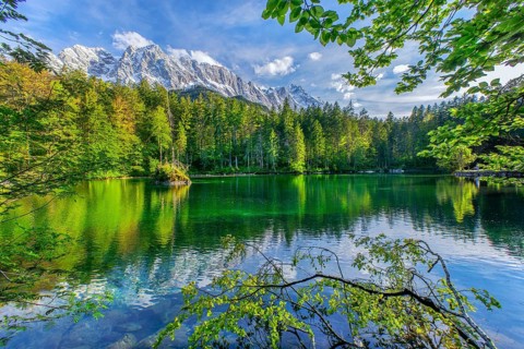 Lake Badersee in spring with Zugspitze group 2962m in the Wetterstein mountains, Zugspitz village