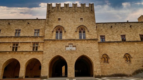Super wide angle shot, view of the Tor tor and the facade of an old castle under a cloudy sky, sky