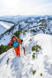 Hiker in winter climbing the Aiplspitz, Mangfall mountains, Bavarian Prealps, Bavaria, Tyrol,