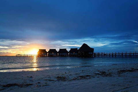Sunset with clouds on the Kae beach, Zanzibar, Tanzania, Africa