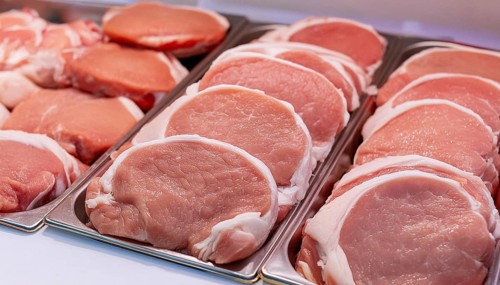 Meat, raw pork, schnitzel, in a display of a butcher's shop, AI generated, AI generated