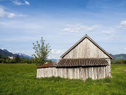 Hay barn in the evening light, behind Trautenfels Castle, near Irdning, Ennstal, Styria, Austria,