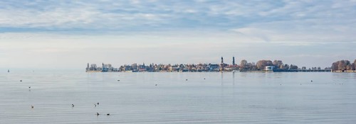 View over the lake to the village of Lindau Island with church towers, Lindau, Lake Constance,