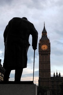 Winston Churchill statue silhouetted behind Big Ben at dusk, Bridge Street, SW1 London, England,