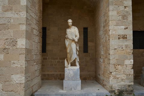 Statue of a standing figure in ancient dress in a sandstone niche, 2nd century BC statue,