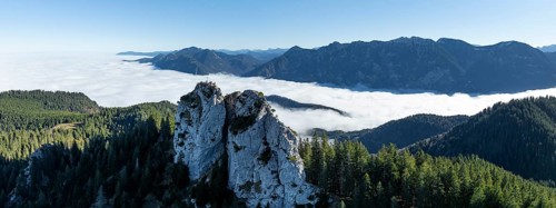 Aerial view, rocky summit of the Ettaler Manndl, view over mountain landscape and sea of clouds,