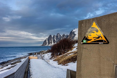 Warning sign for dangerous waves, Tungeneset, Senja, Troms, Norway, Europe
