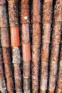 Close-up of old corroded pipes with orange and brown color variations