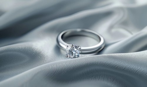 A diamond ring placed on a smooth satin material background AI generated