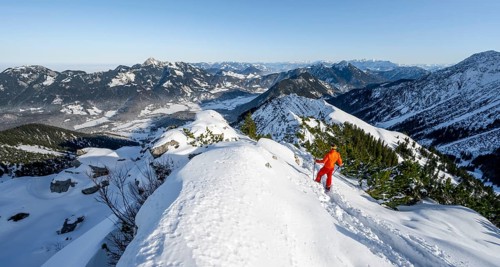 Mountaineer on the summit of the Aiplspitz in the snow, snow-covered mountain landscape with