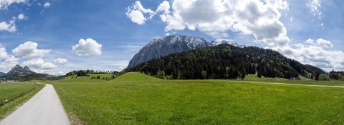 Ennstal cycle path, field path leads through meadows, behind the Grimming, panoramic view, near