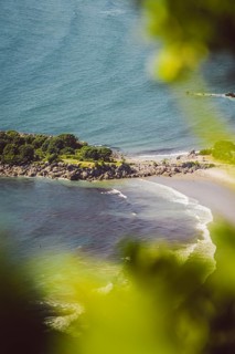 View from the vantage point of Mount Manganui with a view of the sea and a peninsula. Taken in
