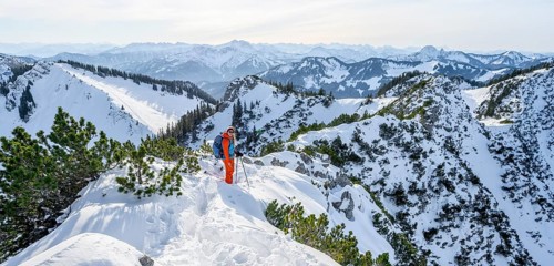 Hiker in winter climbing the Aiplspitz, Mangfall mountains, Bavarian Prealps, Bavaria, Tyrol,
