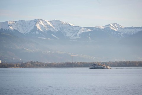 Excursion boat on Lake Constance, snow-covered mountain peaks, Lindau Island, Lake Constance,