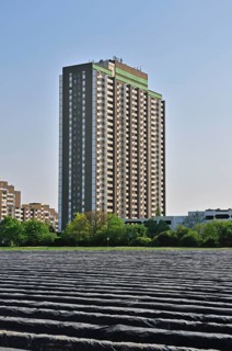 Covered asparagus field, behind it the KoelnBerg, a social hotspot in Cologne-Meschenich, North