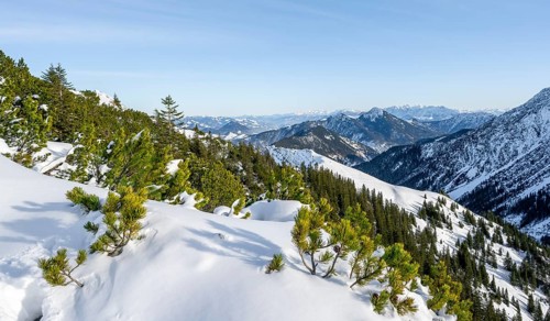 View from the summit of the Aiplspitz in winter, snow-covered mountain landscape with mountain