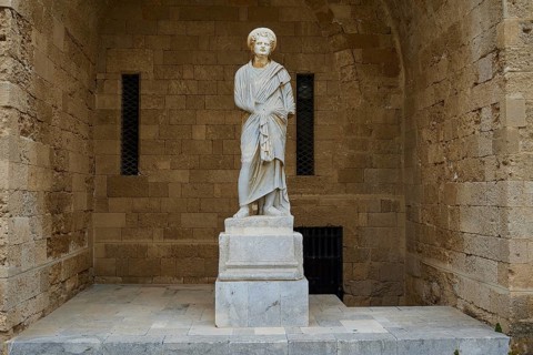 Statue of a woman in antique style with draped robe on column, Roman statue, courtyard, Grand