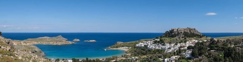 View of the Acropolis, Pallas Beach and the white houses of Lindos, Rhodes, Dodecanese archipelago,