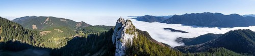 Aerial view, rocky summit of the Ettaler Manndl, view over mountain landscape and sea of clouds,