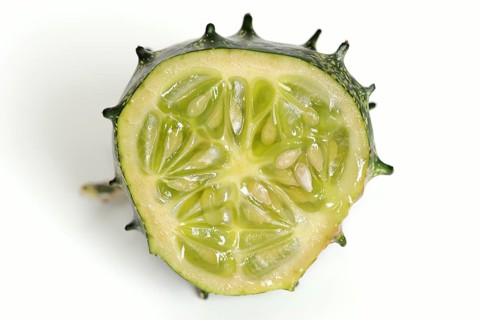 African horned melon (Cucumis metuliferus), sliced fruit on a white background