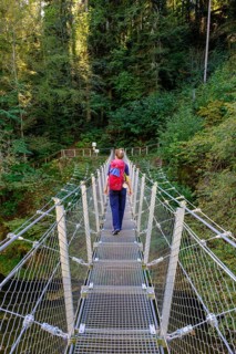 Hikers at the suspension bridge over the Danube, Inzigkofen Princely Park near Sigmaringen, Upper