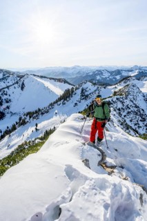 Mountaineer on the ridge of the Aiplspitz in the snow, snow-covered mountain landscape with