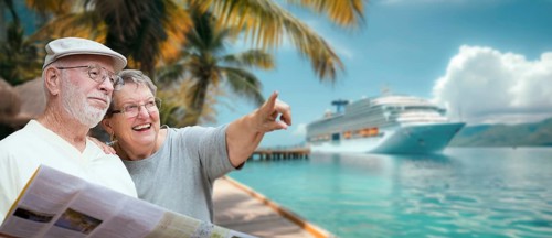 Senior adult couple enjoying the view from the dock with passenger cruise ship in the background