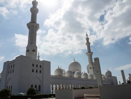 The grandiose mosque lends the sublime architecture a special beauty under the radiant sky, large