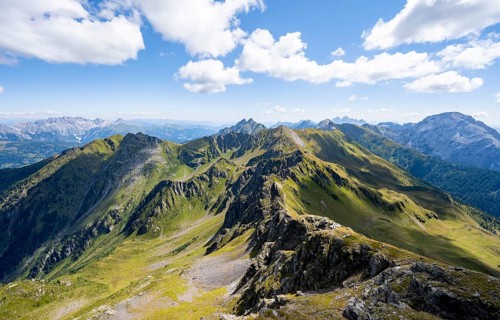 Mountain panorama at the summit of the Hochspitz or Monte Vacomun, view of the mountain ridge of