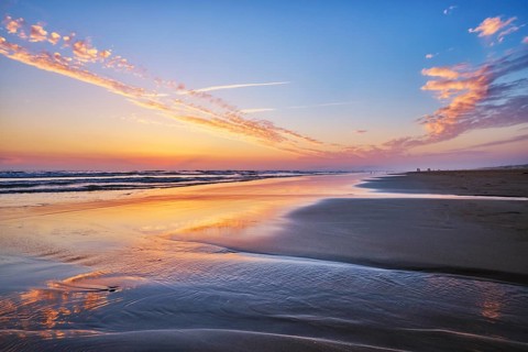 Atlantic ocean after sunset with surging waves at Fonte da Telha beach, Costa da Caparica,