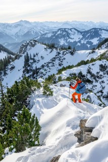 Hiker in winter climbing the Aiplspitz, Mangfall mountains, Bavarian Prealps, Bavaria, Tyrol,