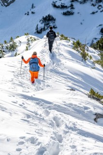 Hikers in winter descending the Aiplspitz, Mangfall mountains, Bavarian Prealps, Bavaria, Tyrol,