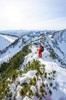 Mountaineer on the ridge of the Aiplspitz in the snow, snow-covered mountain landscape with
