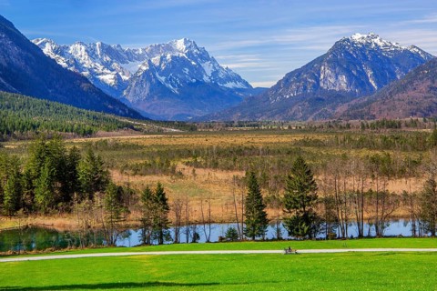 Moorland Seven Springs in spring in front of Zugspitzgruppe 2962m in the Wetterstein Mountains and