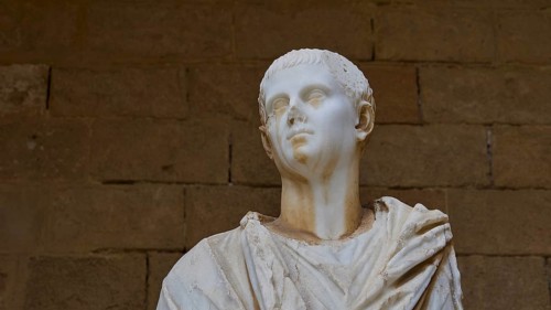 Detailed marble bust from antiquity with recognisable facial features, marble head from the island