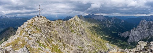Rocky, pointed summit of the Raudenspitze or Monte Fleons with summit cross, view of the Val Fleons
