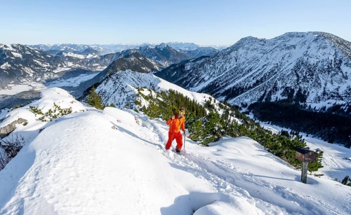 Mountaineer on the summit of the Aiplspitz in the snow, snow-covered mountain landscape with