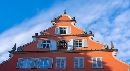 Detail of the red facade of the New Town Hall with carillon, Lindau Island, Lake Constance,