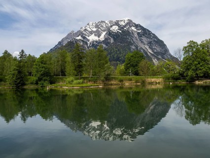 Grimming is reflected in See, Trautenfels near Liezen, Styria, Austria, Europe