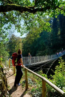 Hikers at the suspension bridge over the Danube, Inzigkofen Princely Park near Sigmaringen, Upper