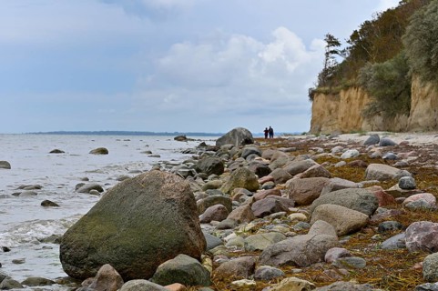 Natural beach with rocks on the steep coast of the island of Poel, Baltic Sea, Mecklenburg-Western
