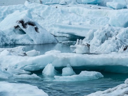 Glacier landscape with snow-covered icebergs and an ice-cold watercourse, Ice Lake, Iceland, Europe
